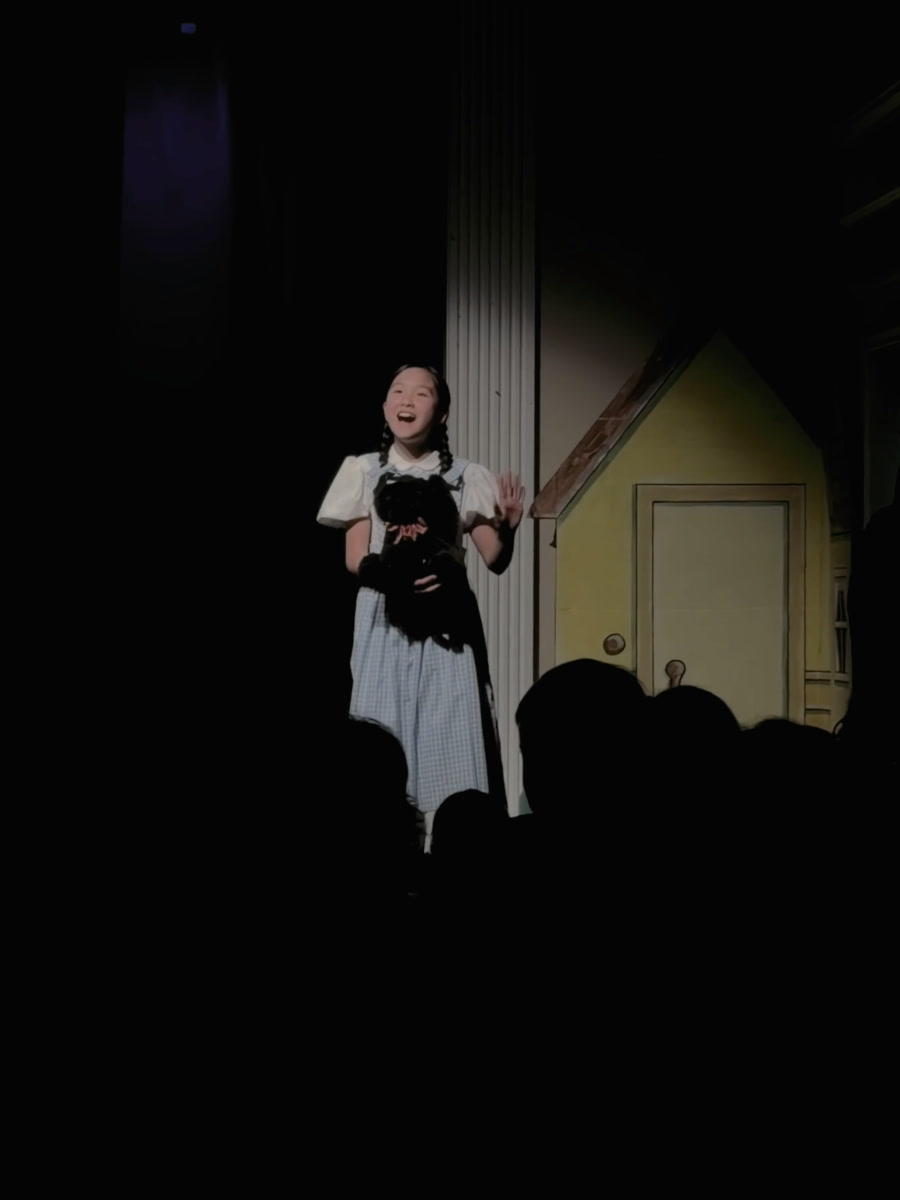 Christine Huang as Dorothy in The Wizard of Oz, spotlight headshot